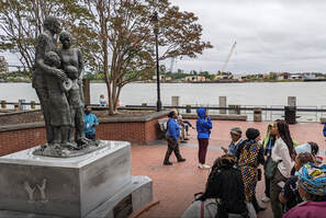 ACCENT group observes the African-American Monument on River Street. The statue is the first major monument in Savannah to commemorate the contributions of its Black citizens to the city’s history, economy and culture, and to acknowledge its role in the institution of slavery.